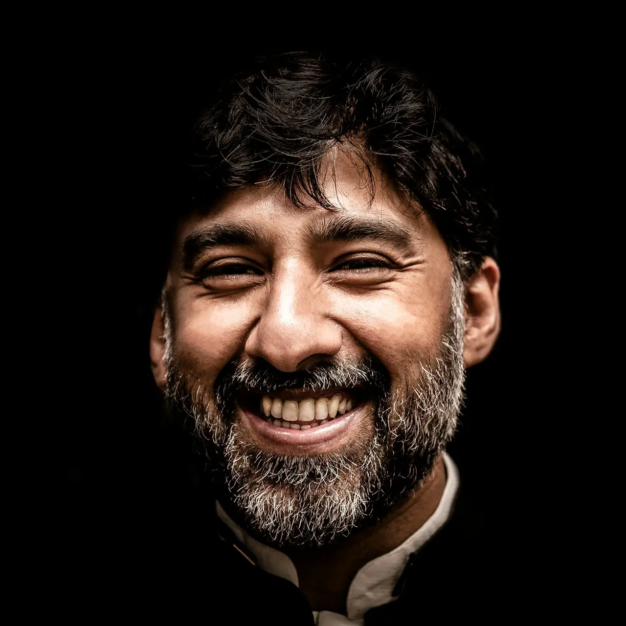 man wearing black and white top